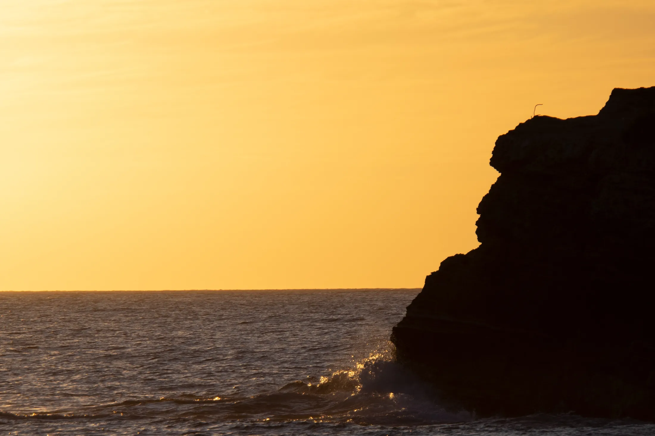 Sunset over the Caribbean sea from Kalatua at Mullet Bay