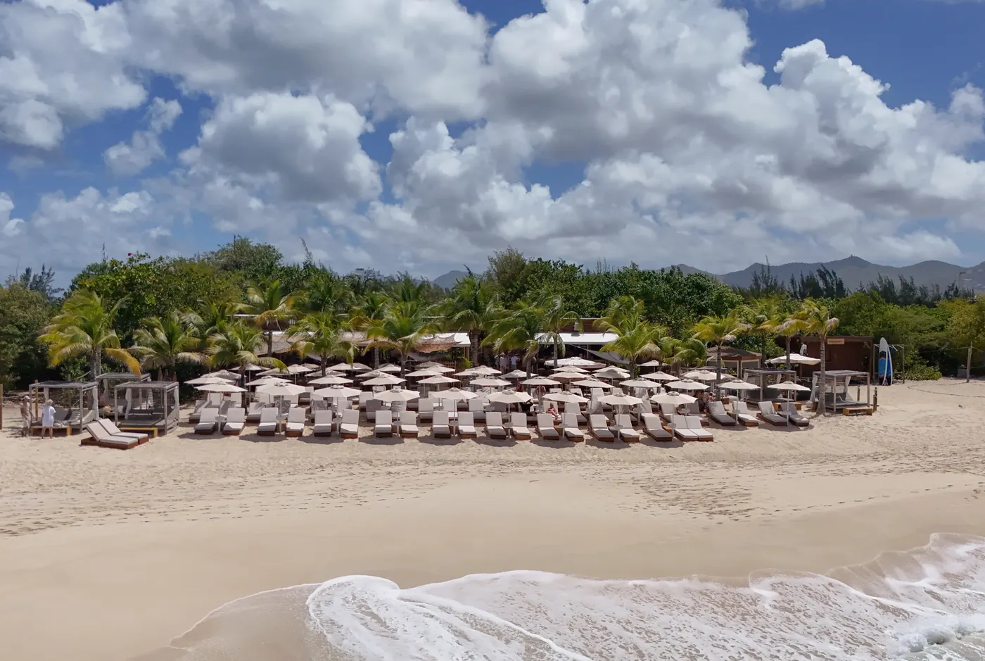 Kalatua beach restaurant at Mullet Bay with loungers on the sand, Sint Maarten